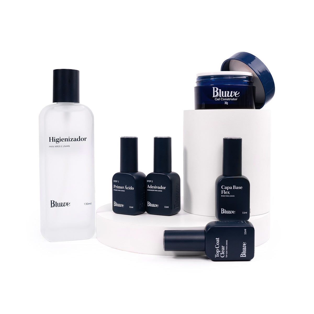 Kit aderência perfeita com os produtos em fundo branco, são eles: Higienizador, preparadores, Capa Base Flex, Gel Construtor e Top Coat Clear